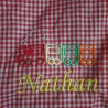 Service de broderie sur tablier d'écolier