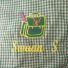 Service de broderie sur tablier d'écolier