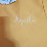Service de broderie sur tablier d'écolier